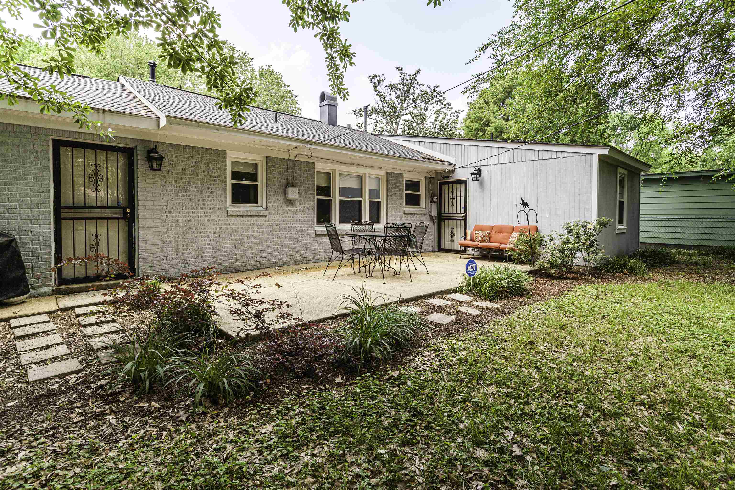 1368 Dearing Road Memphis, TN 38117 - Photo 18 of 19 a house view with a sitting space and garden