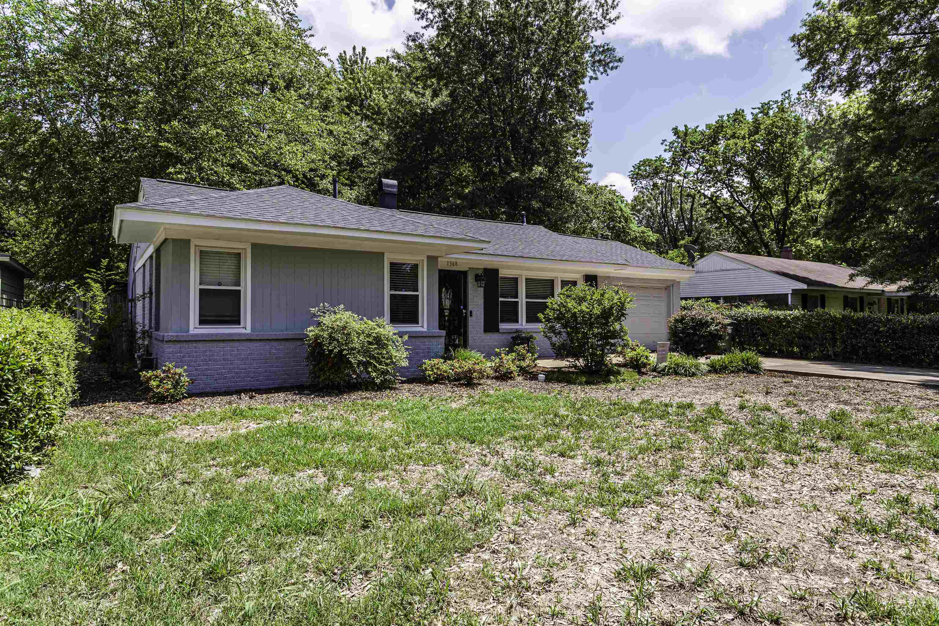 1368 Dearing Road Memphis, TN 38117 - Photo 2 of 19 a view of a house with backyard sitting area and garden