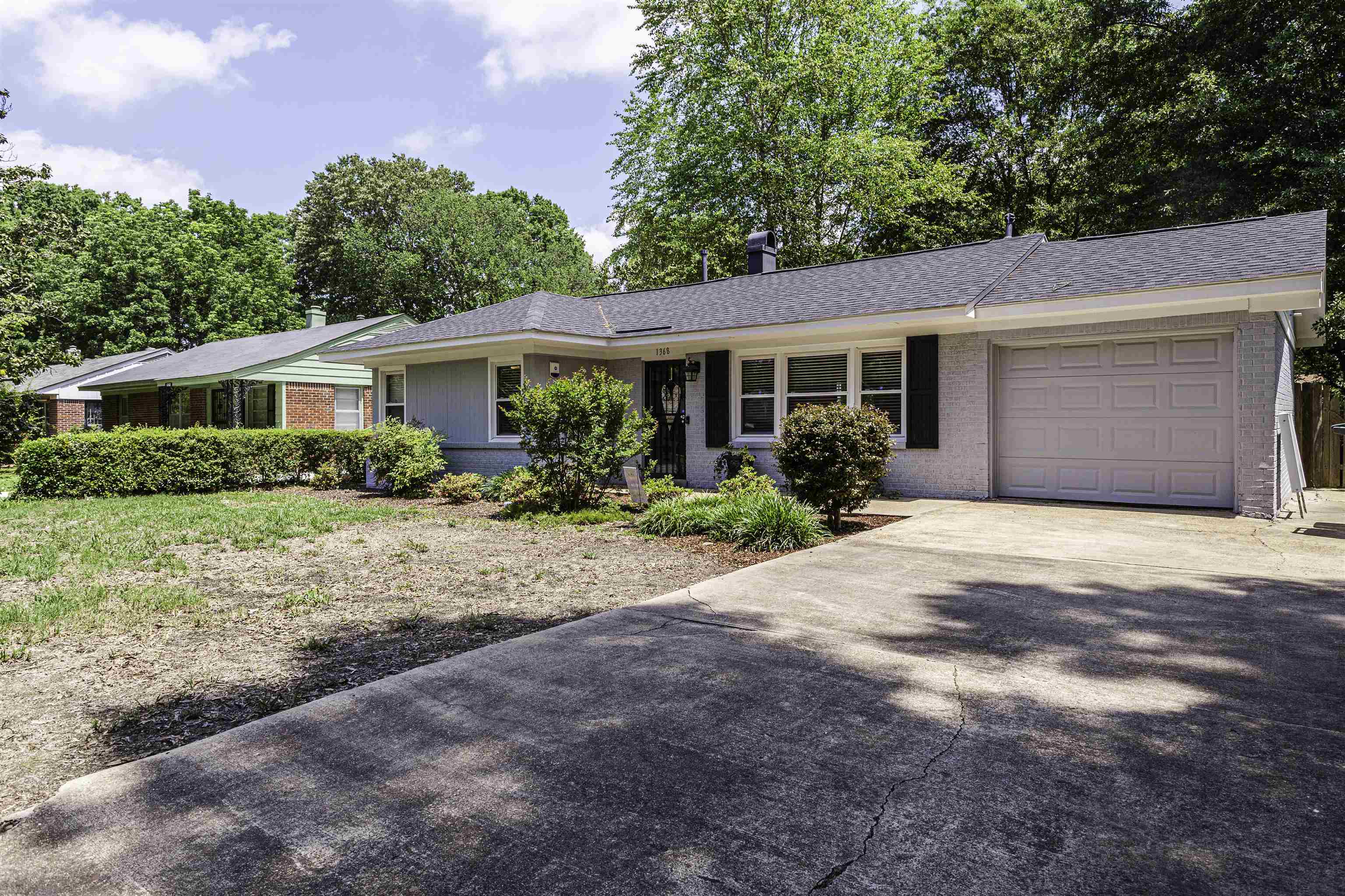 1368 Dearing Road Memphis, TN 38117 - Photo 3 of 19 a front view of a house with garden