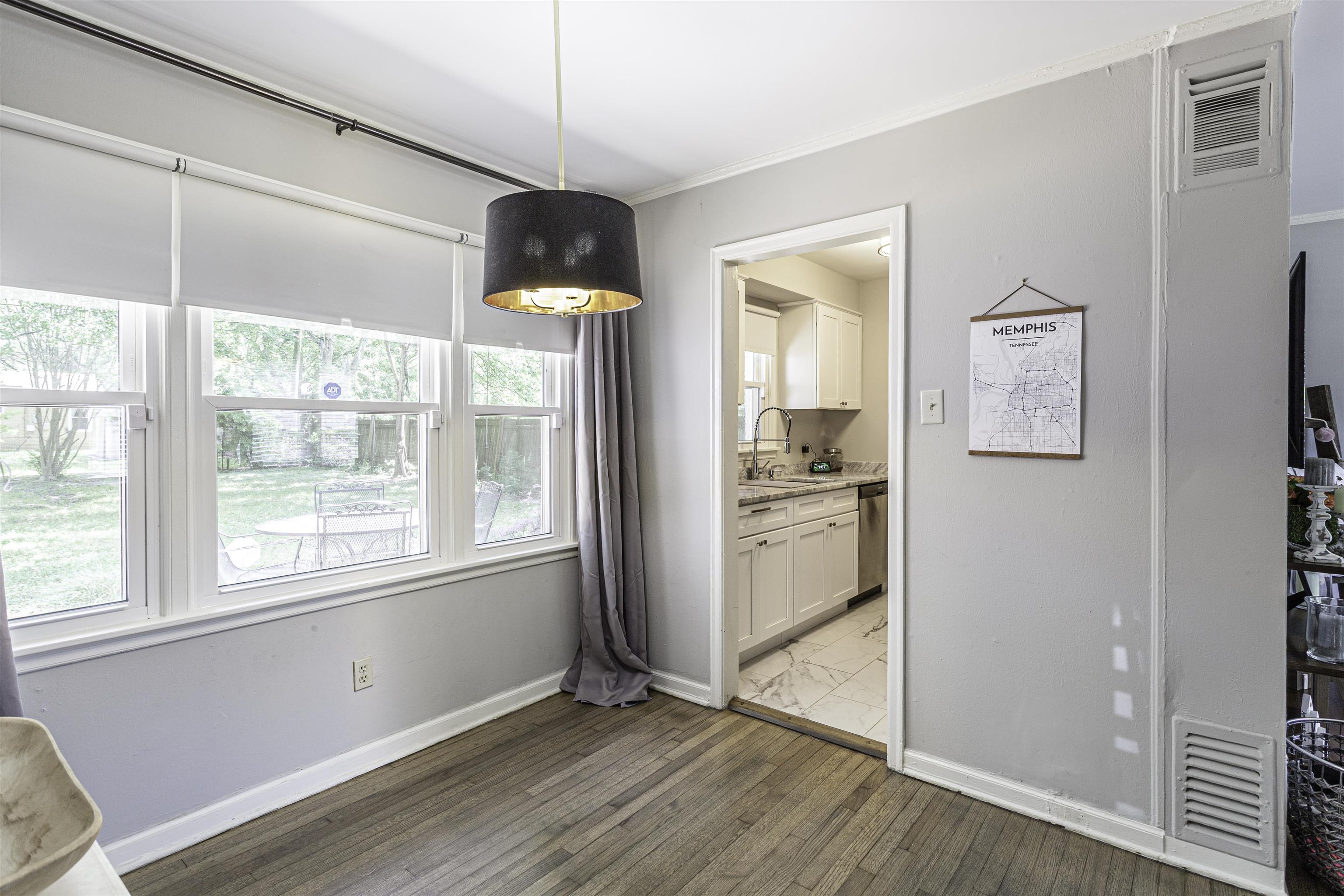 1368 Dearing Road Memphis, TN 38117 - Photo 7 of 19 a view of empty room with wooden floor and fan