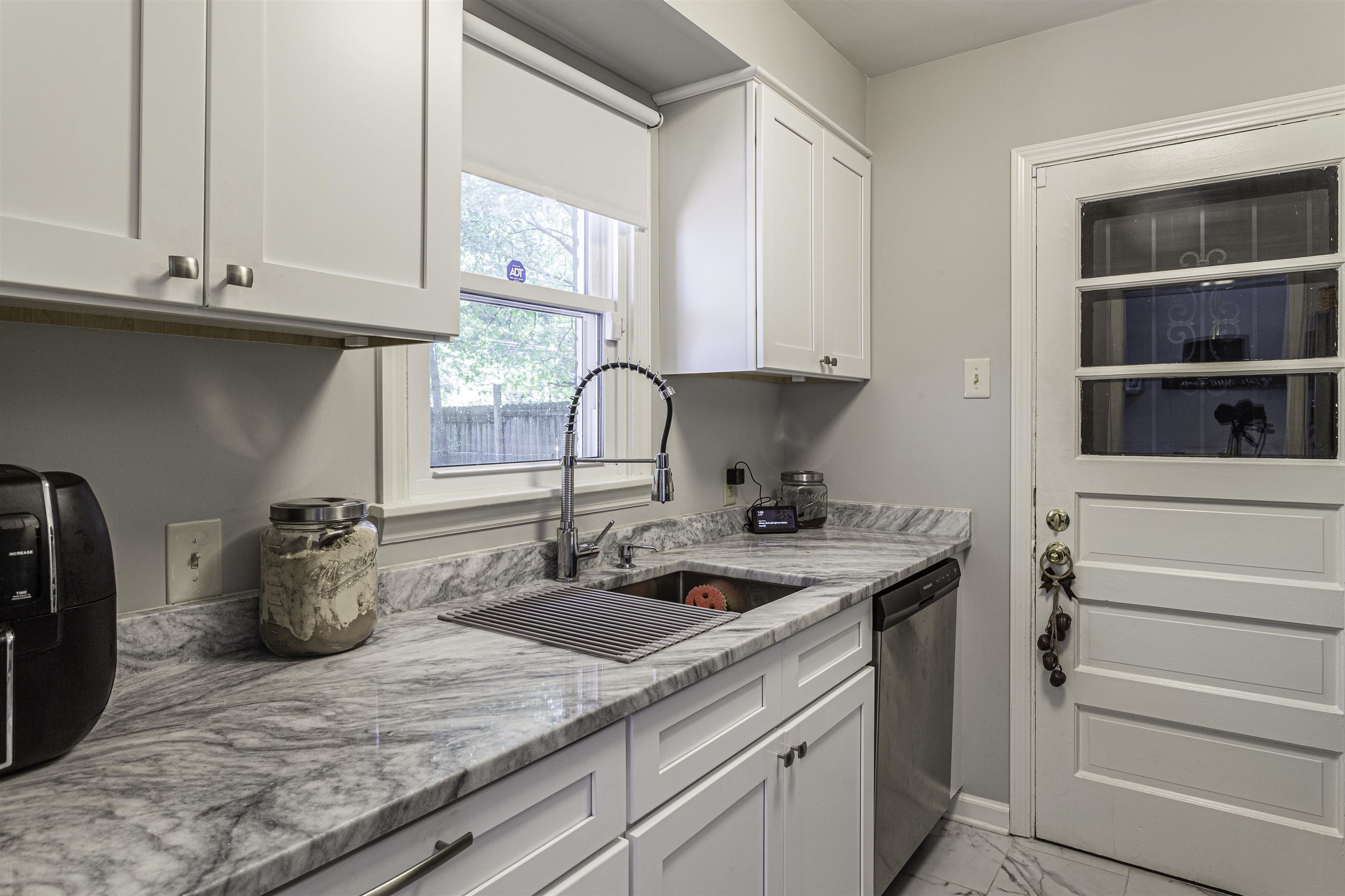 1368 Dearing Road Memphis, TN 38117 - Photo 9 of 19 a kitchen with a sink and cabinets