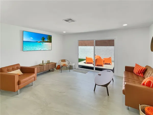 a living room with furniture and a couch