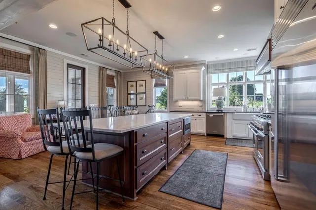 a bedroom with furniture and a large window