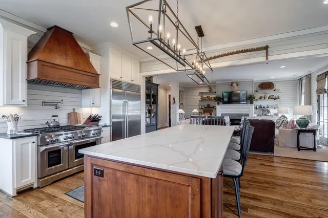 a house view with a seating space and balcony
