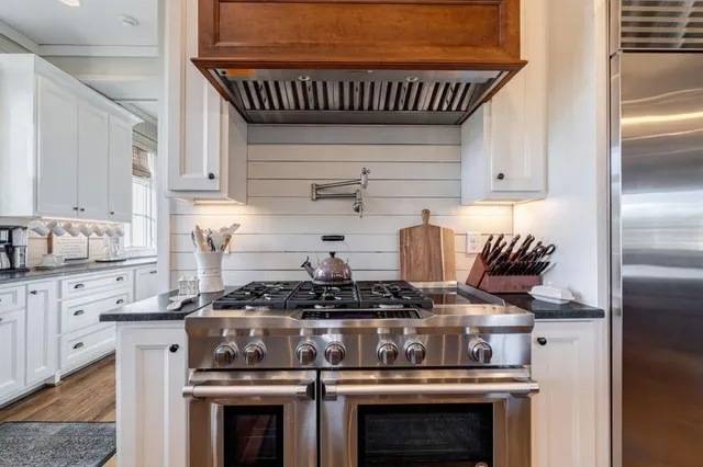 a view of entryway with wooden floor and stairs