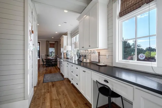 a bed room with a bed mirror and a window