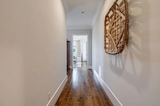 a bathroom with a toilet and a shower curtain