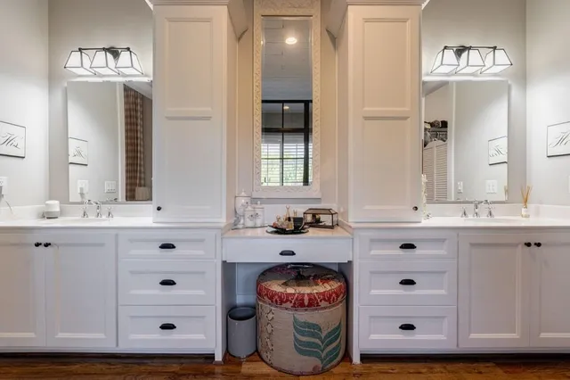 a view of a house with a big yard and large trees