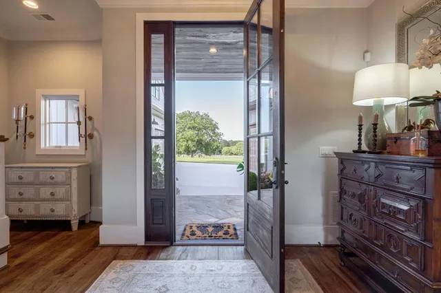 a view of a dining room with furniture wooden floor and chandelier
