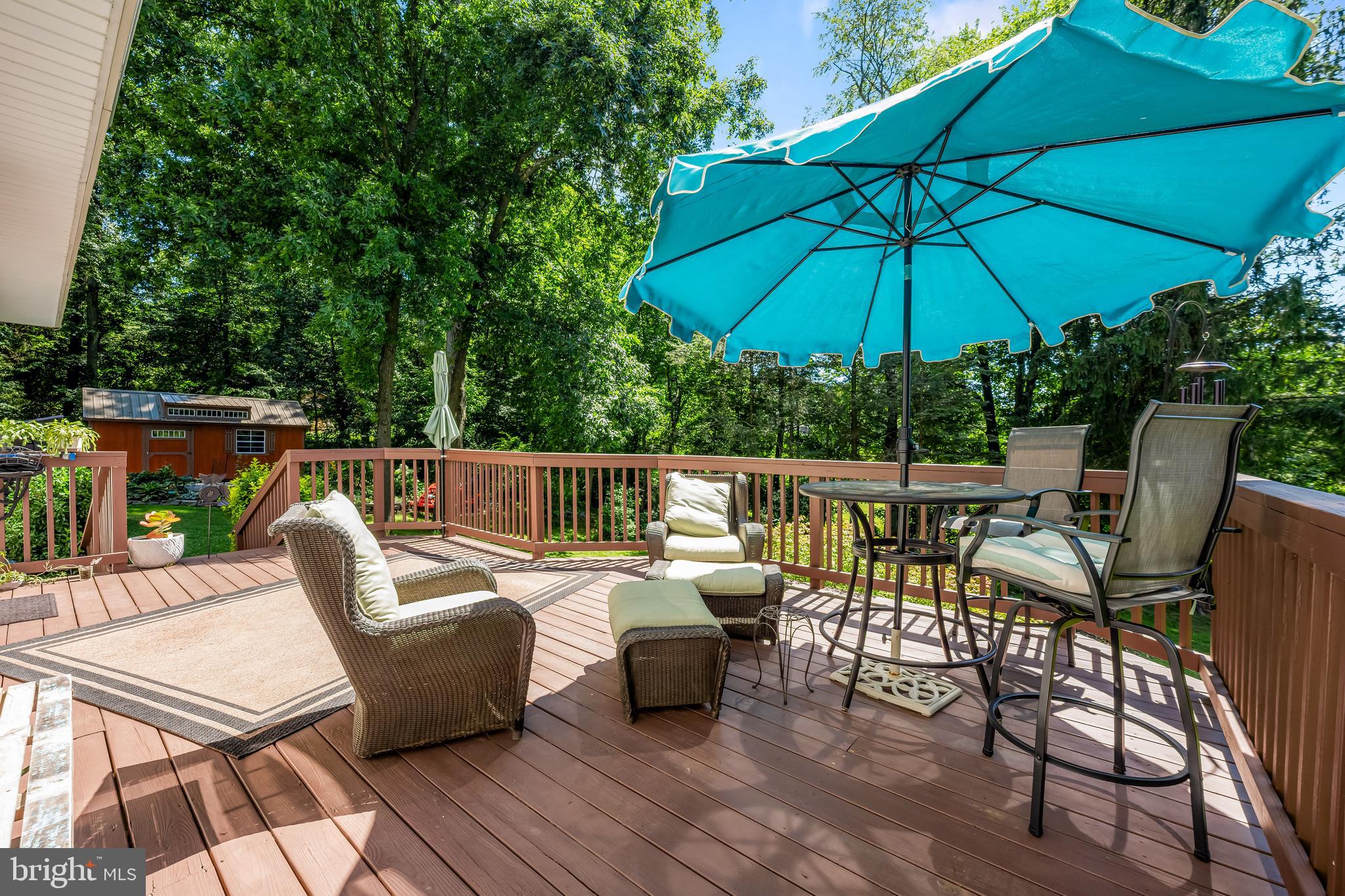 5026 Mt Carmel Road Hampstead, MD 21074 - Photo 22 of 57 a patio with wooden floor a yard table and chairs