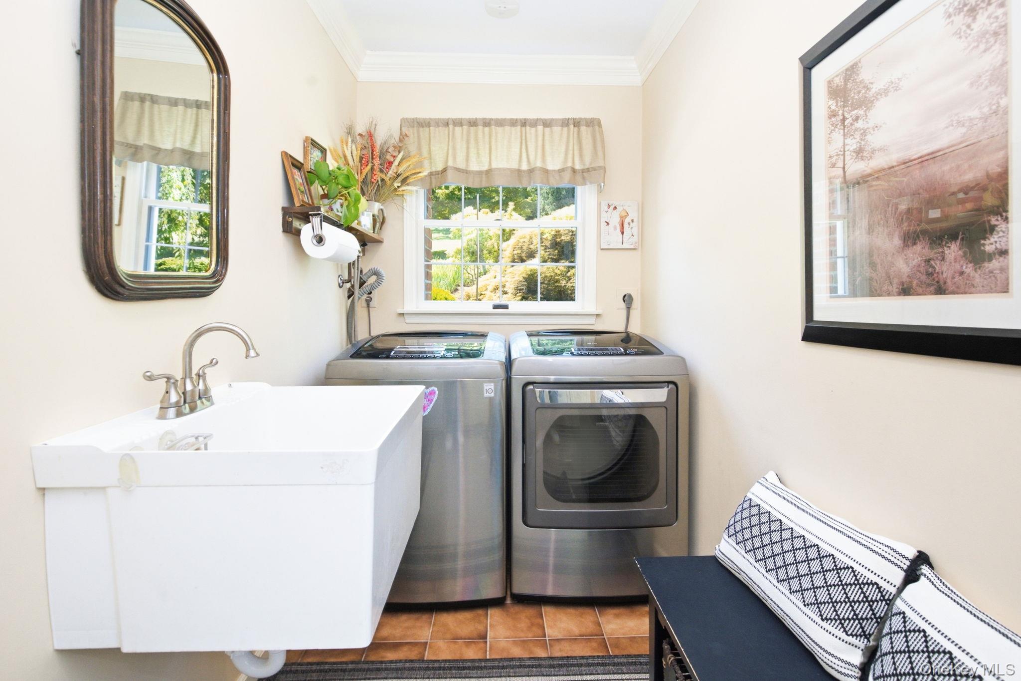 32 Bedell Road Katonah, NY 10536 - Photo 19 of 49 The dedicated laundry room pairs the LG washer and dryer with a practical slop sink.