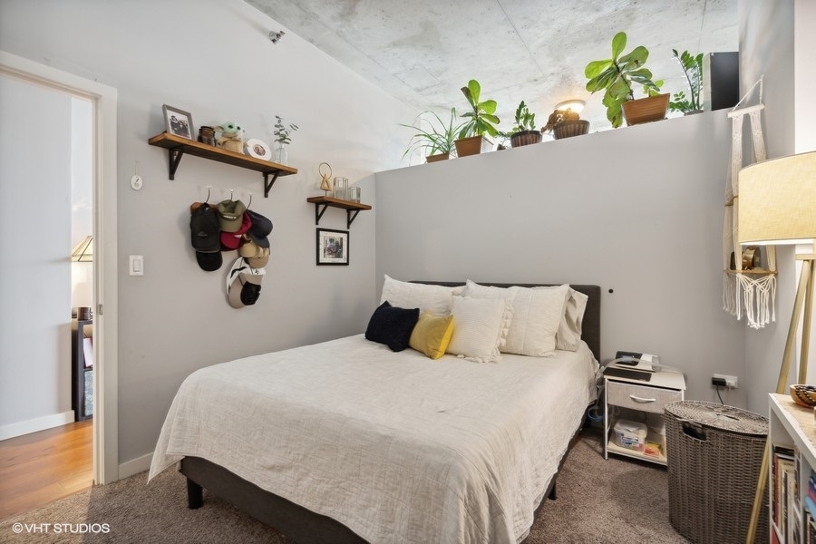 235 West Van Buren Street, Unit 3606 Chicago, IL 60607 - Photo 17 of 27 a bedroom with a bed and a window
