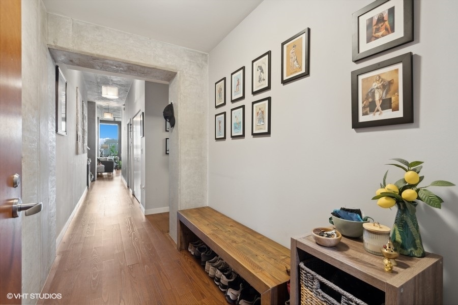 235 West Van Buren Street, Unit 3606 Chicago, IL 60607 - Photo 9 of 27 a view of a hallway with workspace and wooden floor