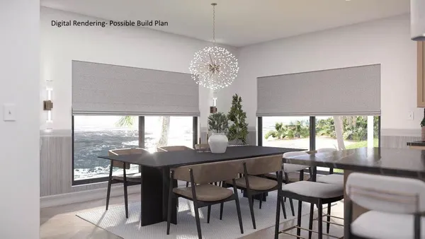 a kitchen with kitchen island a counter top space a sink a refrigerator and cabinets