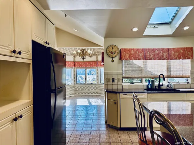 a bedroom with a bed and a mirror