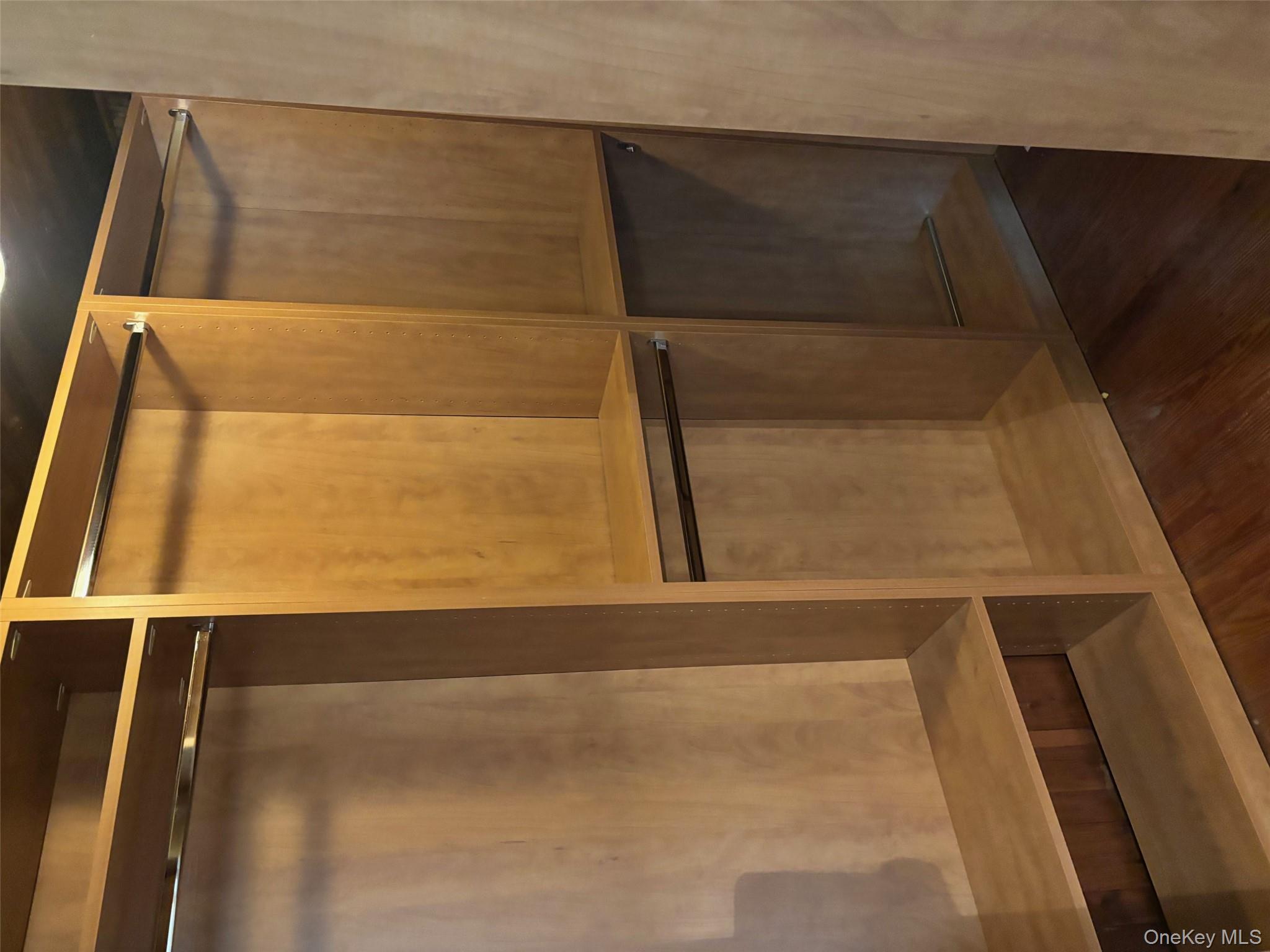 185 South Country Road, Unit S COUNTRY RD East Patchogue, NY 11772 - Photo 30 of 47 Walk in closet for the primary bedroom with dark wood-style floors