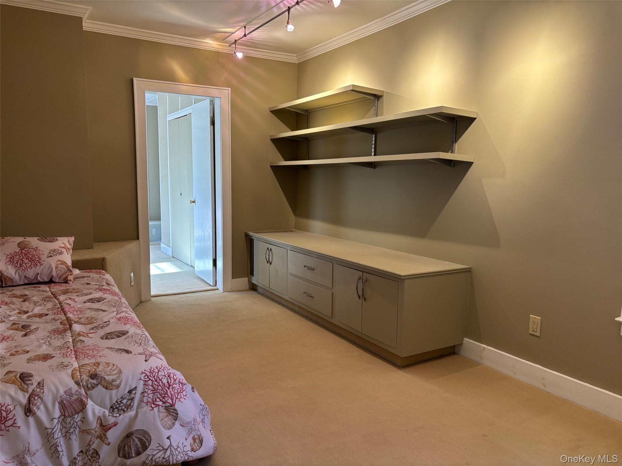 185 South Country Road, Unit S COUNTRY RD East Patchogue, NY 11772 - Photo 35 of 47 a bedroom with a bed and cabinets