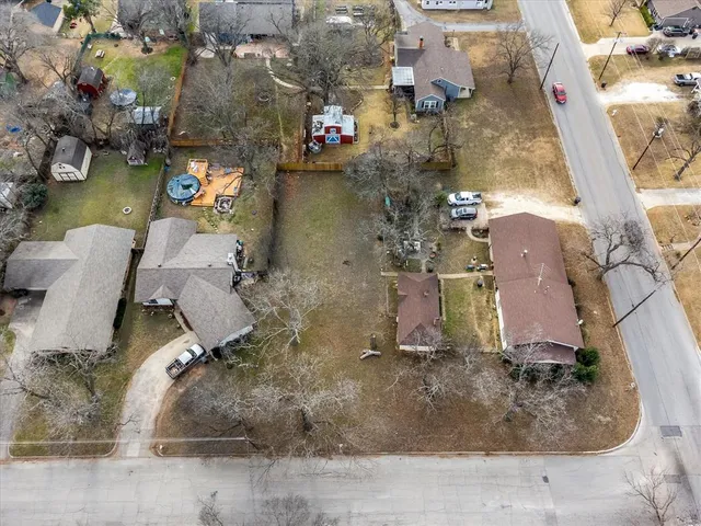 an aerial view of a residential apartment building with a yard