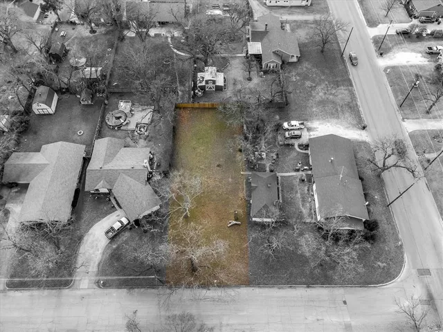an aerial view of a house with outdoor space
