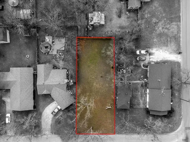 an aerial view of a house with outdoor space