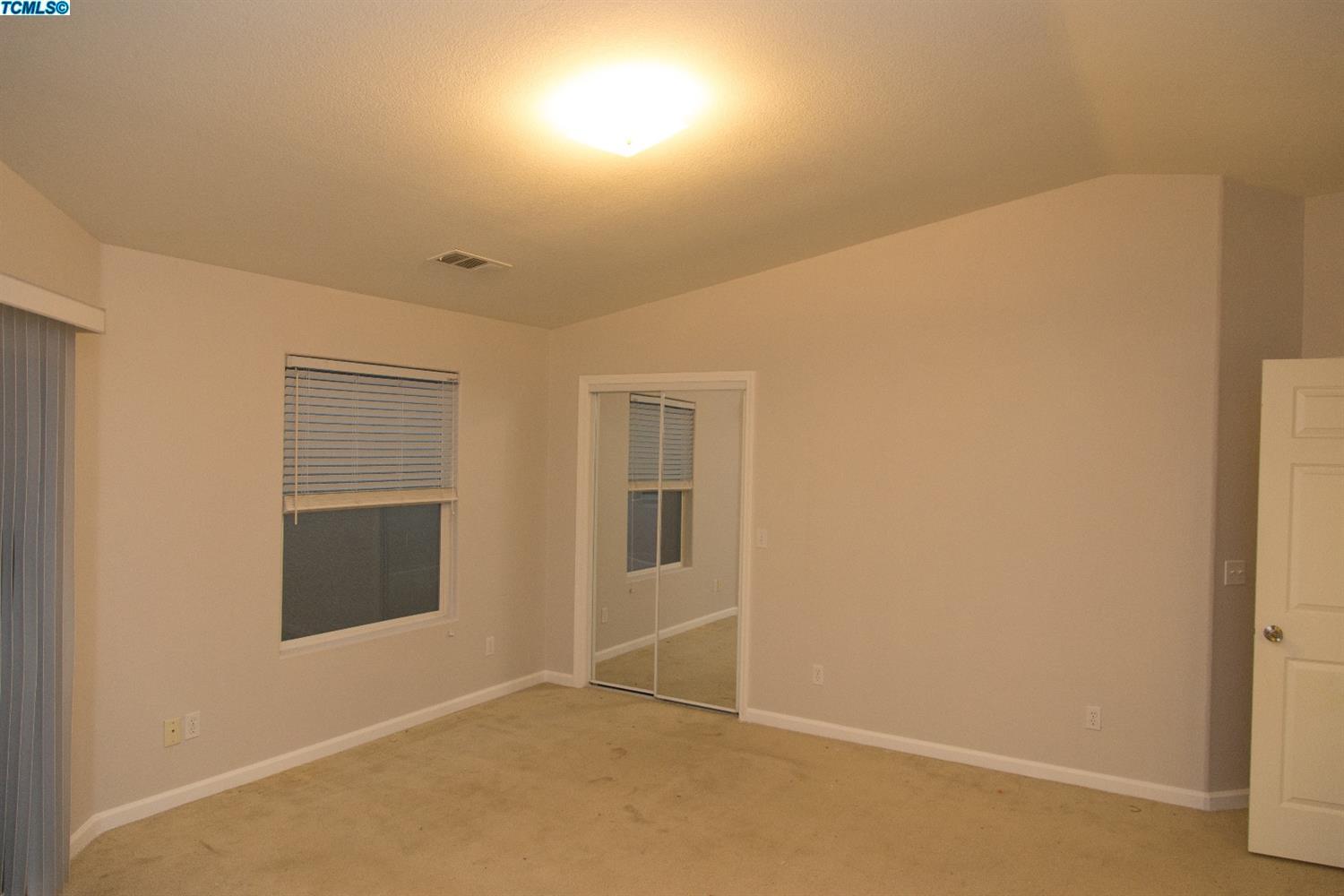 148 South Filbert Road Exeter, CA 93221 - Photo 20 of 23 an empty room with windows