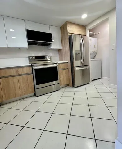 a bathroom with a toilet a sink and shower