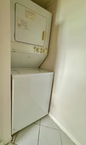 a bathroom with a glass shower door and mirror