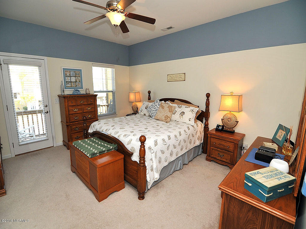 770 Bonaire Road Wilmington, NC 28412 - Photo 11 of 24 Master bedroom with door to front porch