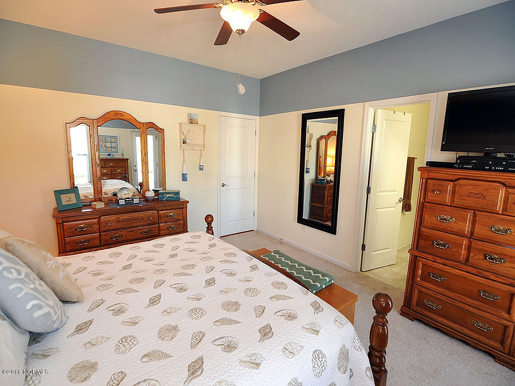 770 Bonaire Road Wilmington, NC 28412 - Photo 12 of 24 Master bedroom with door to front porch
