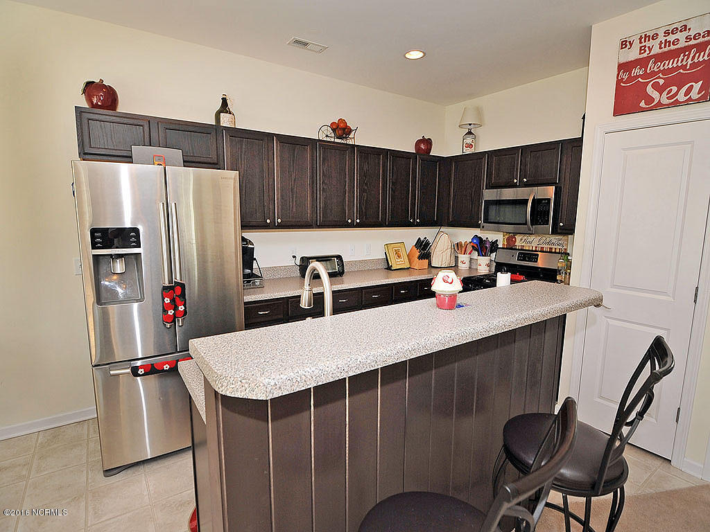 770 Bonaire Road Wilmington, NC 28412 - Photo 2 of 24 Kitchen with stainless appliances