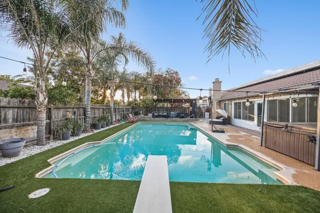 a view of a house with swimming pool