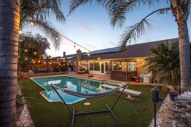 a view of swimming pool with chairs