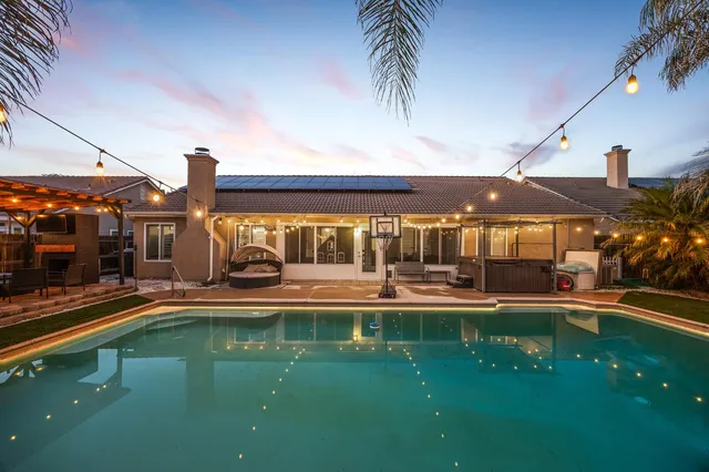 a view of a swimming pool with a garden
