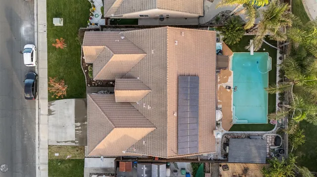 an aerial view of a house with outdoor space