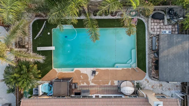 an aerial view of a house with outdoor space