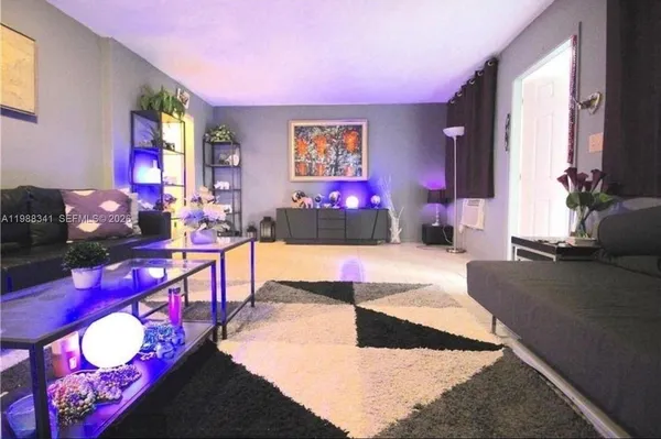 a living room with furniture and window