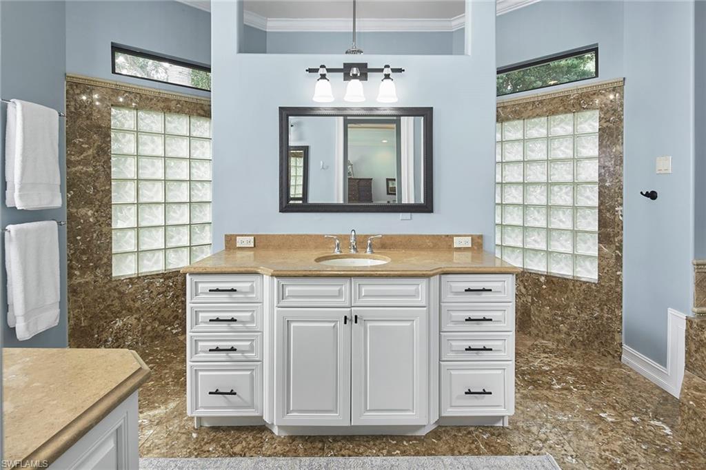 1900 Tiller Terrace Naples, FL 34102 - Photo 21 of 46 a bathroom with a double vanity sink mirror and