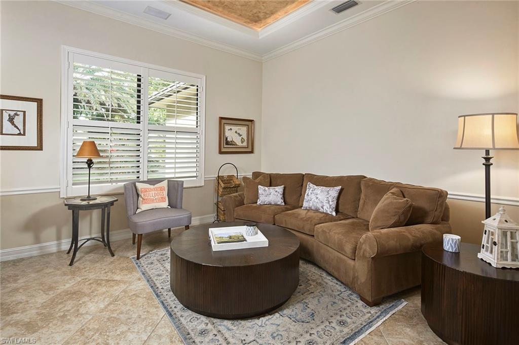 1900 Tiller Terrace Naples, FL 34102 - Photo 24 of 46 a living room with furniture and a large window