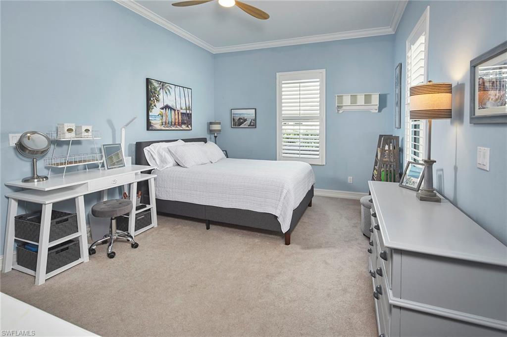 1900 Tiller Terrace Naples, FL 34102 - Photo 27 of 46 a bedroom with a bed and a window