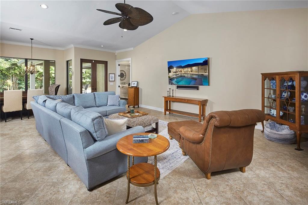 1900 Tiller Terrace Naples, FL 34102 - Photo 9 of 46 a living room with furniture and a flat screen tv