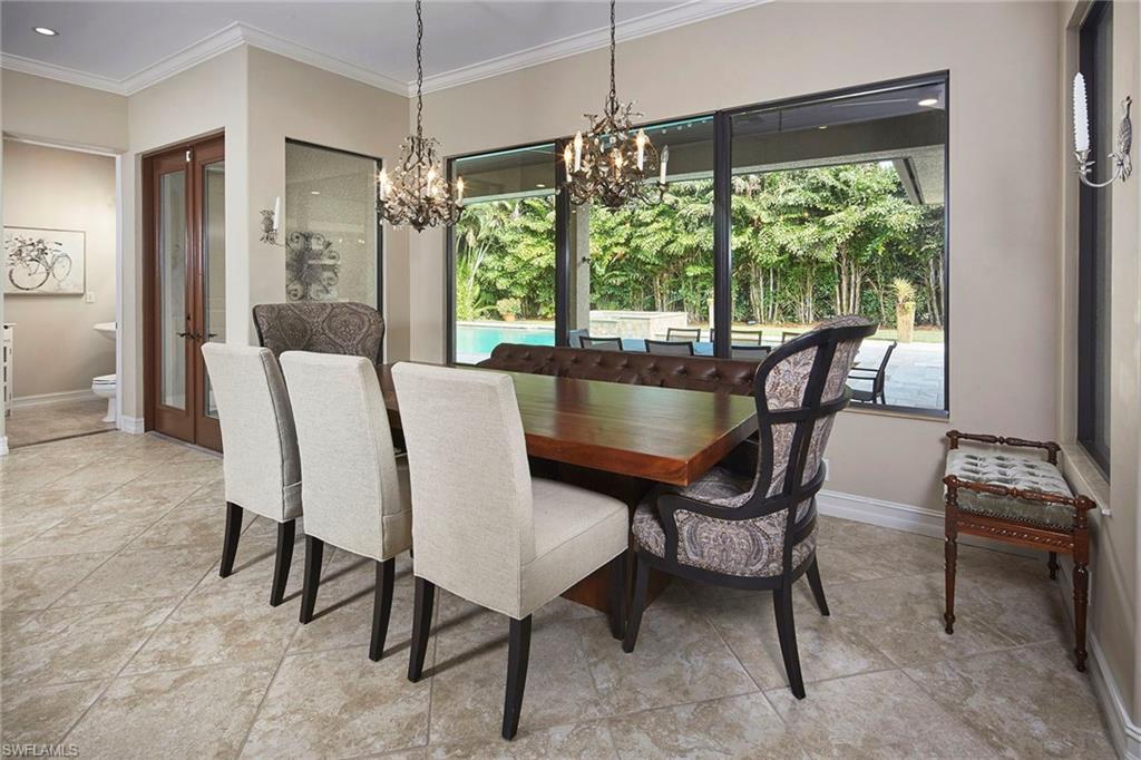 1900 Tiller Terrace Naples, FL 34102 - Photo 10 of 46 a view of a dining room with furniture window and outside view