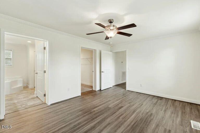 7120 Guess Road Hillsborough, NC 27278 - Photo 11 of 27 an empty room with wooden floor and windows