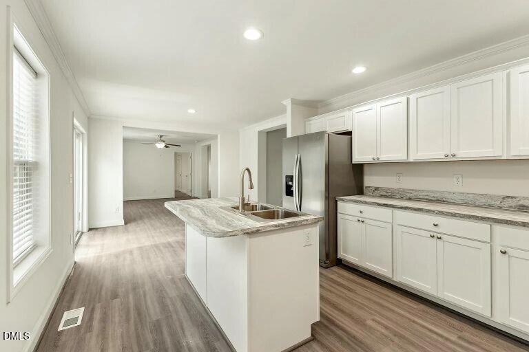 7120 Guess Road Hillsborough, NC 27278 - Photo 12 of 27 a kitchen with stainless steel appliances granite countertop a sink stove and refrigerator