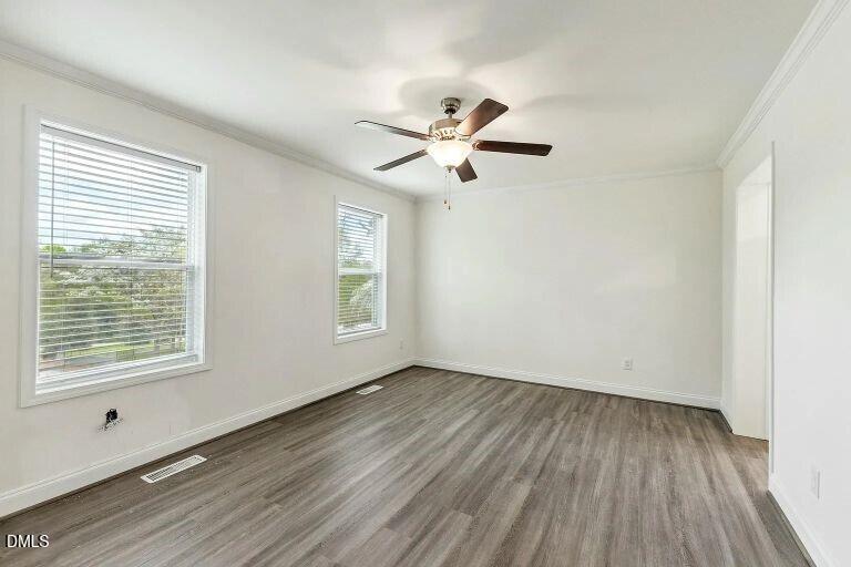 7120 Guess Road Hillsborough, NC 27278 - Photo 13 of 27 a view of empty room with wooden floor and fan