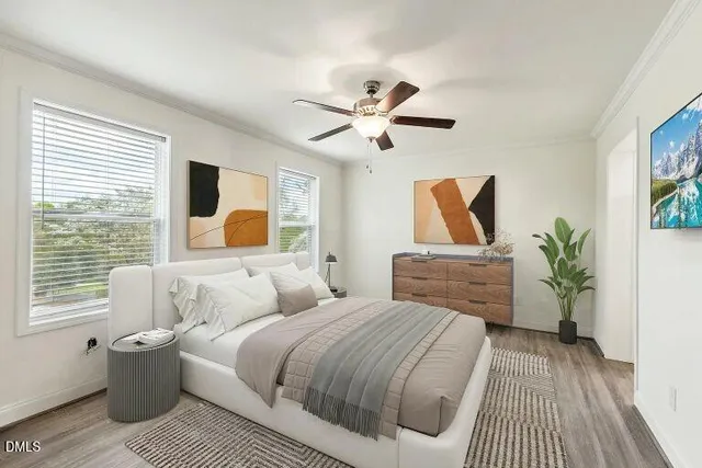 a bedroom with a large bed and a window