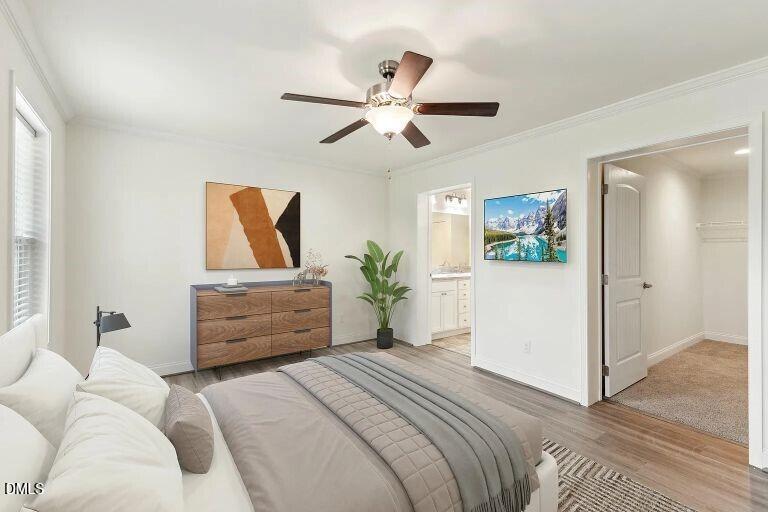 7120 Guess Road Hillsborough, NC 27278 - Photo 27 of 27 a bedroom with a bed and a chandelier