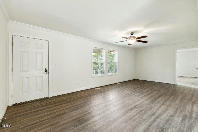 7120 Guess Road Hillsborough, NC 27278 - Photo 8 of 27 a view of an empty room with a window and wooden floor