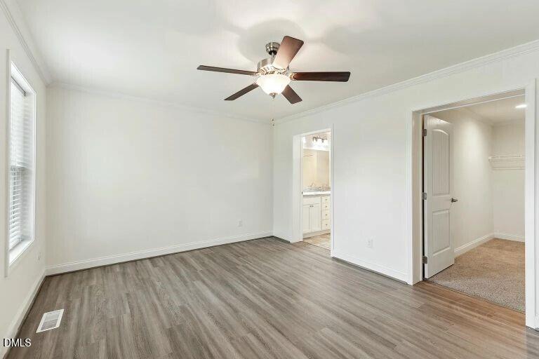 7120 Guess Road Hillsborough, NC 27278 - Photo 10 of 27 wooden floor in an empty room with a window