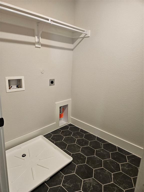 221 Chestnut Street Celina, TX 75009 - Photo 13 of 23 a view of a room with rack on the wall