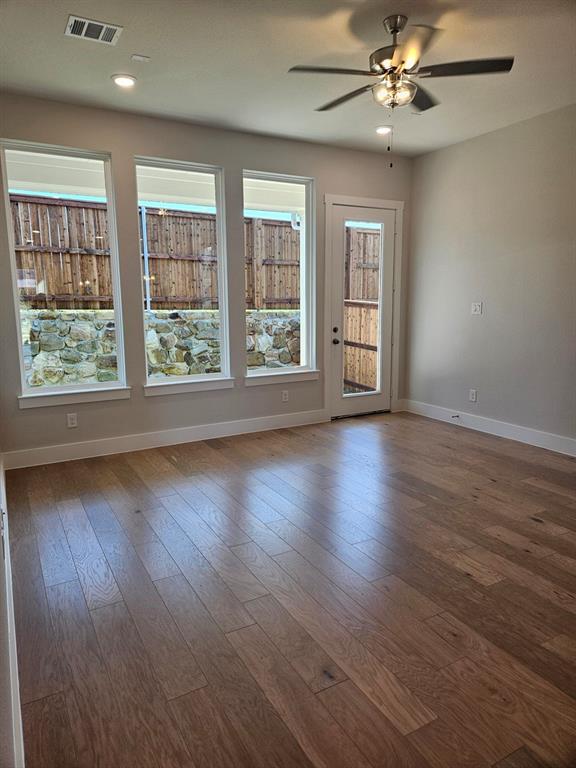221 Chestnut Street Celina, TX 75009 - Photo 20 of 23 a view of wooden floor and windows in a room
